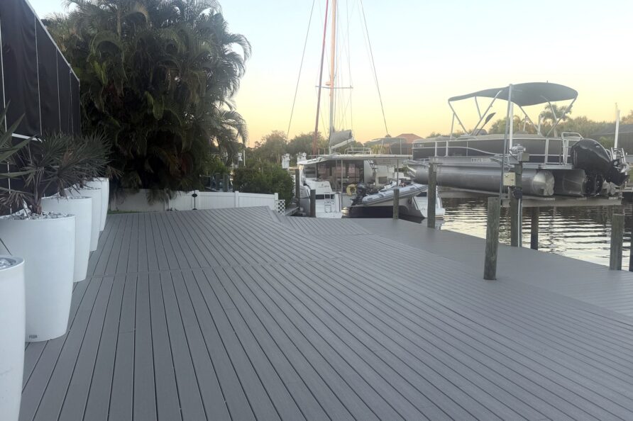 Private dock with boat lift on the canal at sunset — Canal Villa