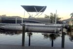 Pontoon boat on the private boat lift — Canal Villa
