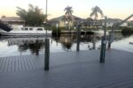 Composite dock and canal at sunset — Canal Villa