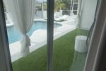 Heated screened pool with sun loungers and private dock