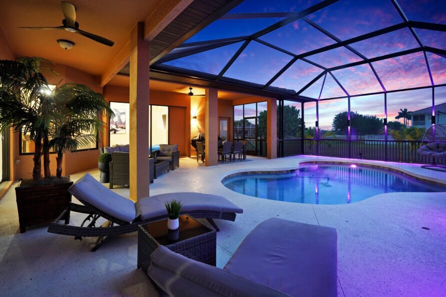 Luxury 4BR Villa Punta Gorda Isles heated saltwater pool and lanai at sunset