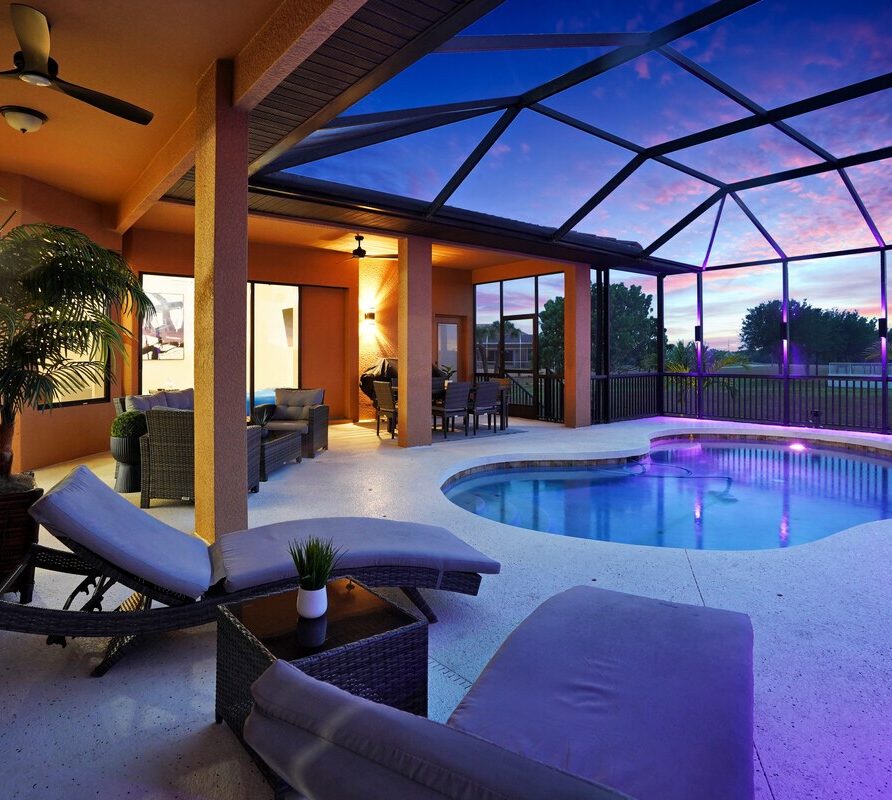 Luxury 4BR Villa Punta Gorda Isles heated saltwater pool and lanai at sunset