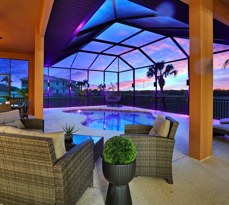 Luxury 4BR Villa Punta Gorda Isles heated saltwater pool and lanai at sunset