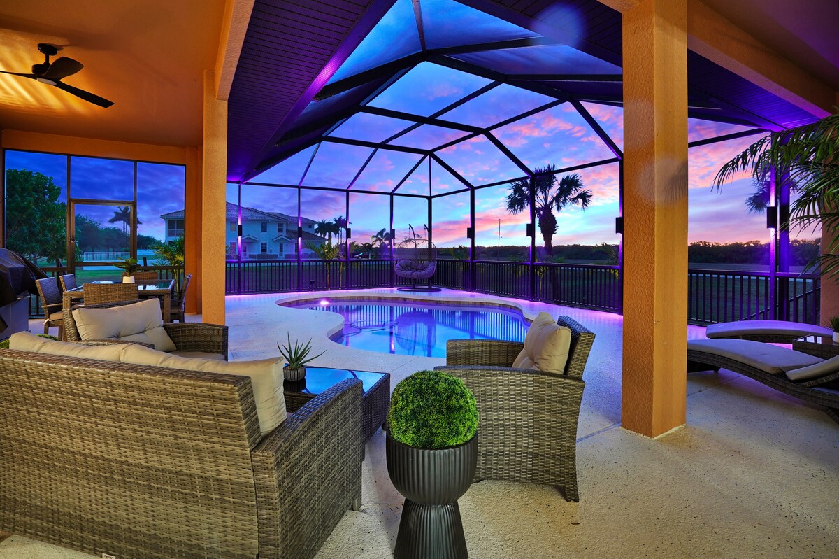 Luxury 4BR Villa Punta Gorda Isles heated saltwater pool and lanai at sunset