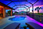Luxury 4BR Villa Punta Gorda Isles heated saltwater pool at dusk