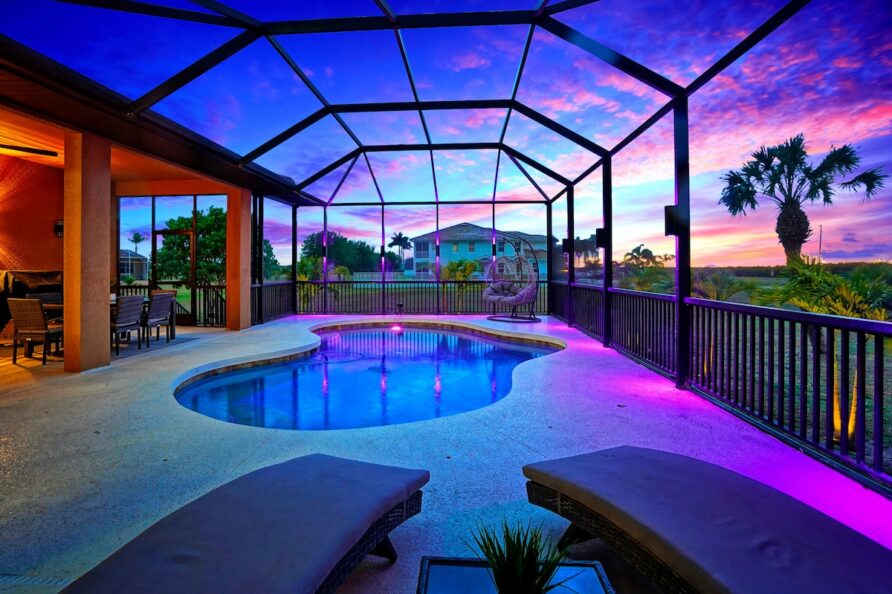 Luxury 4BR Villa Punta Gorda Isles heated saltwater pool at dusk