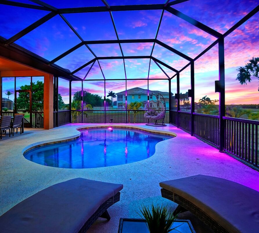 Luxury 4BR Villa Punta Gorda Isles heated saltwater pool at dusk