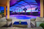 Luxury 4BR Villa Punta Gorda Isles heated saltwater pool and lanai at sunset