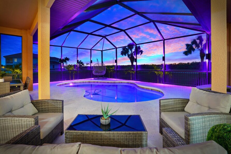 Luxury 4BR Villa Punta Gorda Isles heated saltwater pool and lanai at sunset
