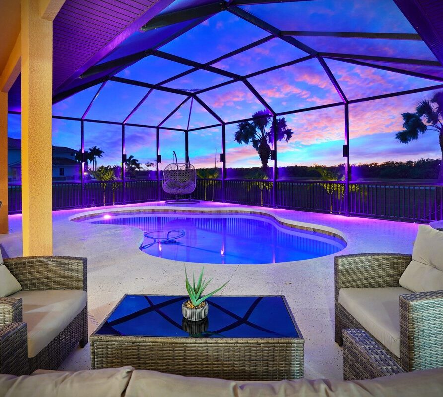 Luxury 4BR Villa Punta Gorda Isles heated saltwater pool and lanai at sunset