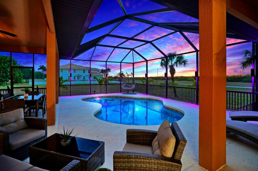 Luxury 4BR Villa Punta Gorda Isles heated saltwater pool and lanai at sunset