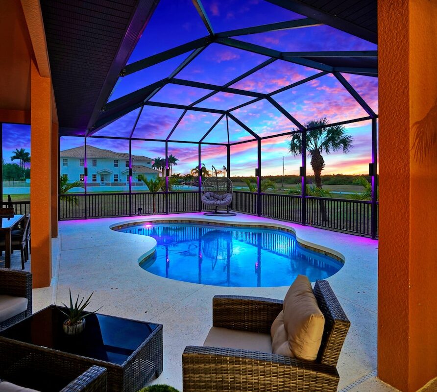 Luxury 4BR Villa Punta Gorda Isles heated saltwater pool and lanai at sunset